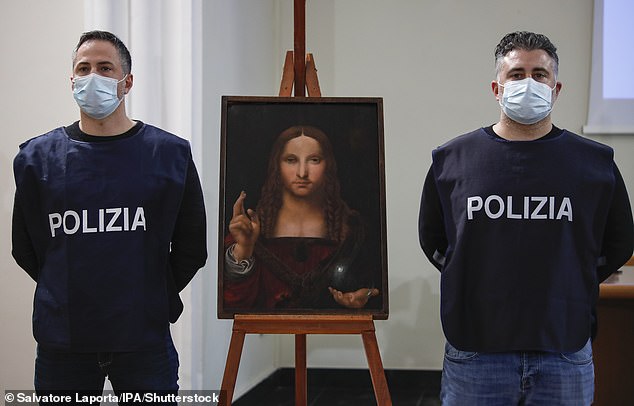 Agents of the crime against heritage division of the Naples Flying Squad display "Salvatore Mundi", A painting from the Leonardo School dating back to the 15th century